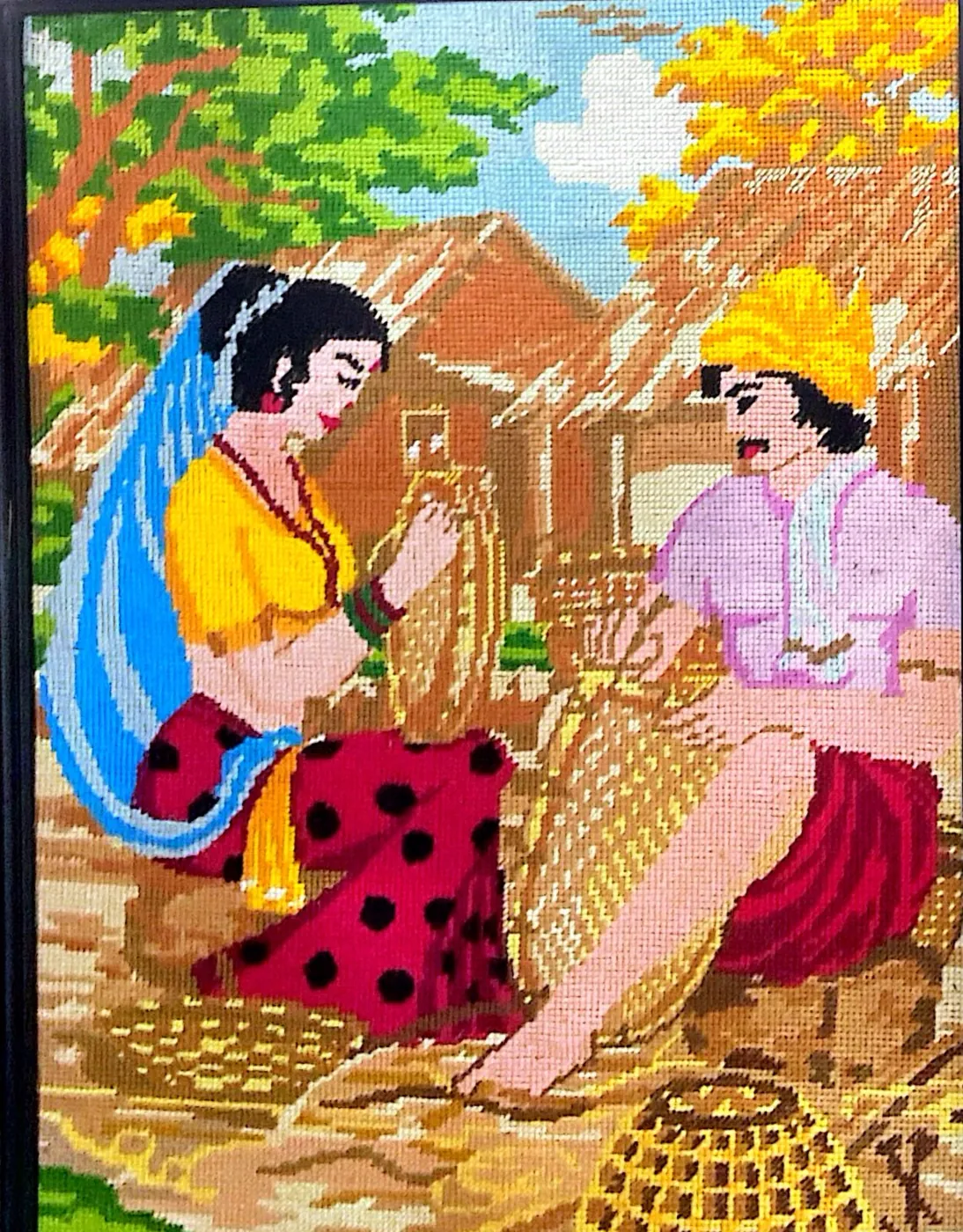 Handmade artwork of a Sri Lankan village couple weaving baskets, traditional rural life scene